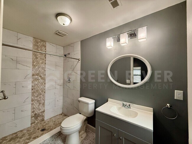 Building Photo - Fully Renovated 2BR Brick Home with Vaulted Ceilings & Backyard Retreat!