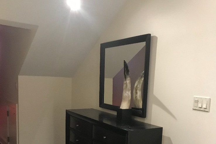 bedroom with dresser - 504 Dumaine St
