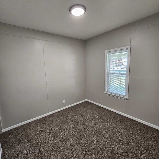 Building Photo - Duplex - 2 Bedroom Completely Remodeled Living Space with New Laminate Flooring on Main Floor alo...