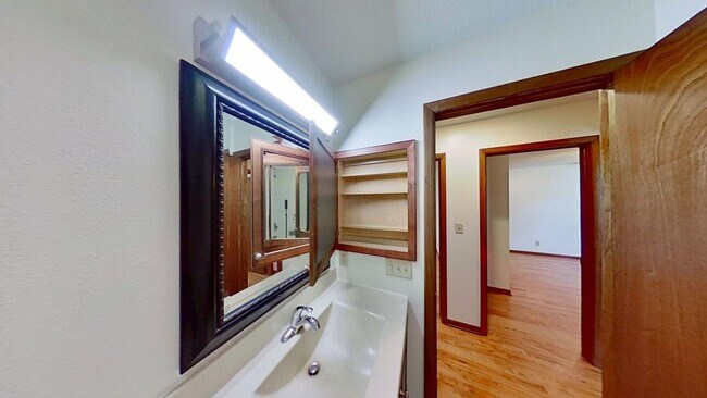 Building Photo - Updated two bedroom duplex, new stainless steel appliances, garage, and hardwood floors