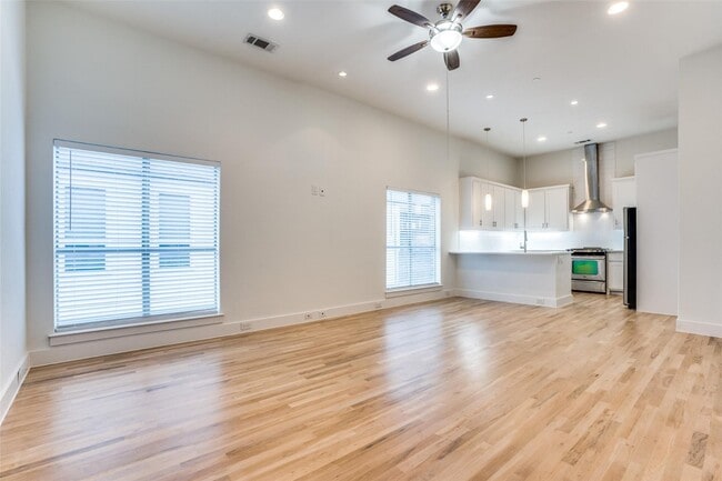 Building Photo - Beautiful townhome featuring granite countertops, hard wood floors, and a small private yard grea...