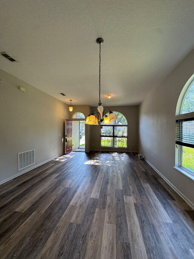 Building Photo - Spacious 4 Bedroom Pond-View Home with Upg...