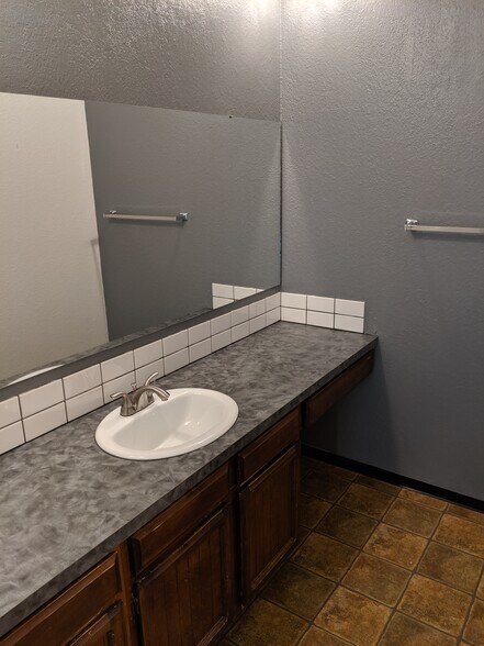 Sink area in upstairs restroom. - 2115 Pleasanton St