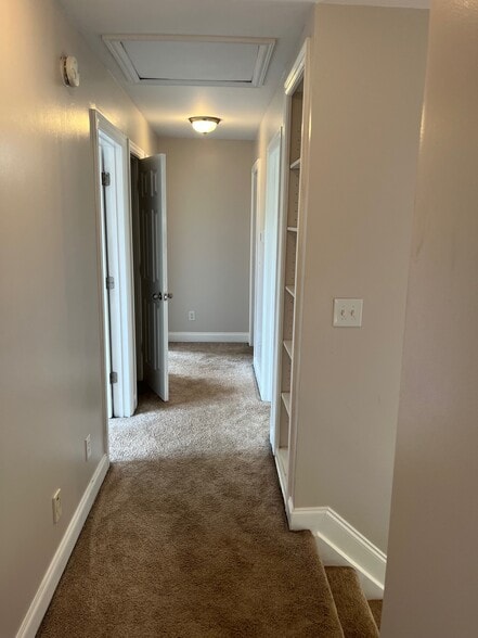 2nd Floor Hallway mily room and primary bedroom. Includes from right to left: The Stairs - 393 Hays Blvd