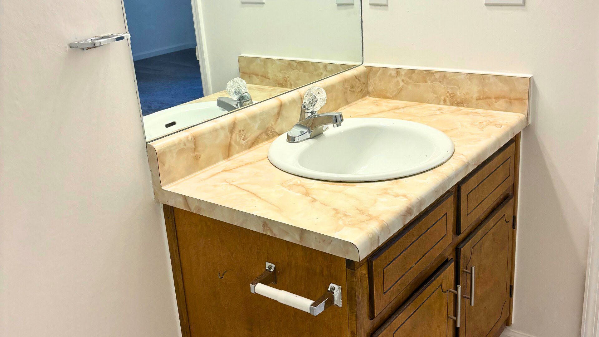 Updated vanity with mirror and storage. - 905 Park Pl NE