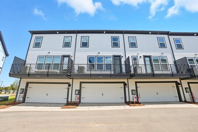 Building Photo - Brand-new three-story townhome in the Univ...