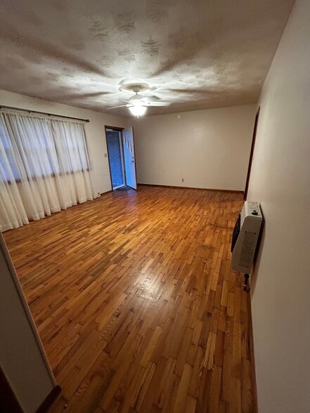 Living room looking from hall - gas auxliary heater - 537 E Glenwood St