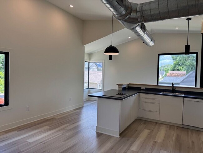 Building Photo - Vaulted Ceilings & Hardwood Floors in This Charming Indianapolis L