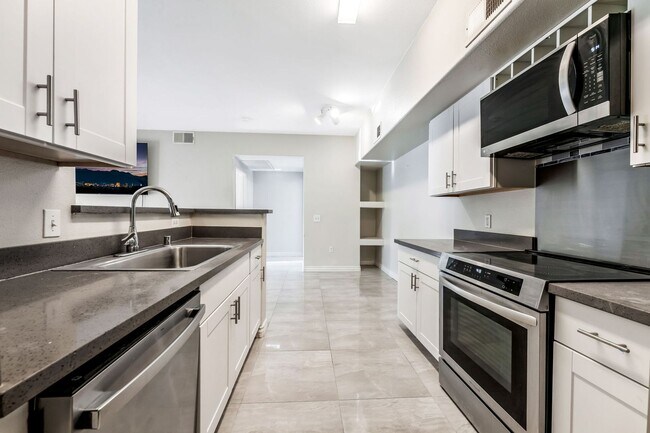 Building Photo - Modern Gated Condo with Upgraded Interior and Attached Garage in Prime South Las Vegas Location!