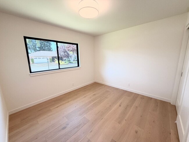 Building Photo - This premier 4-bed, 3-bath estate spans 2,565 sq. ft. on a 10,253 sq. ft. lot in North Los Altos.