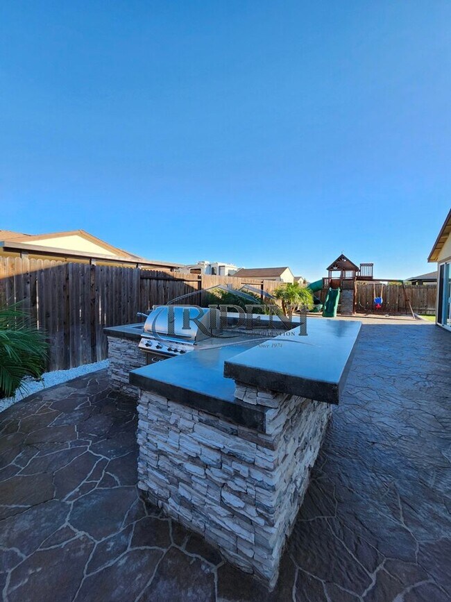 Building Photo - Updated home with a built in BBQ and play area