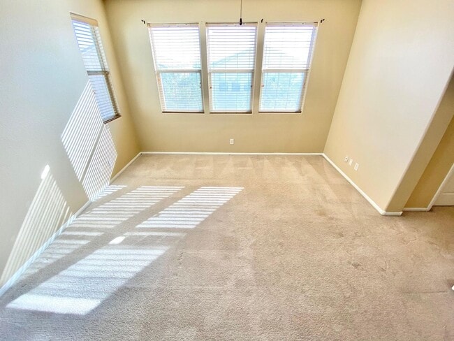 Building Photo - THIS SPACIOUS RESIDENCE FEATURES 4 BEDROOM...