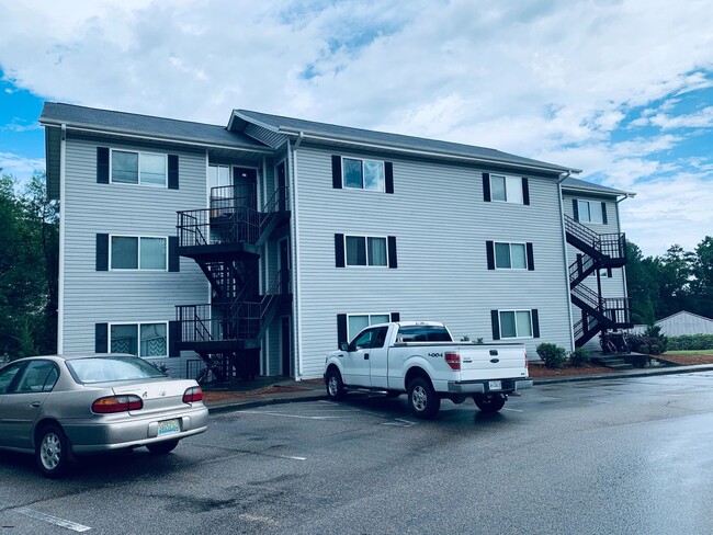 Building Photo - Village Green Condos C-202