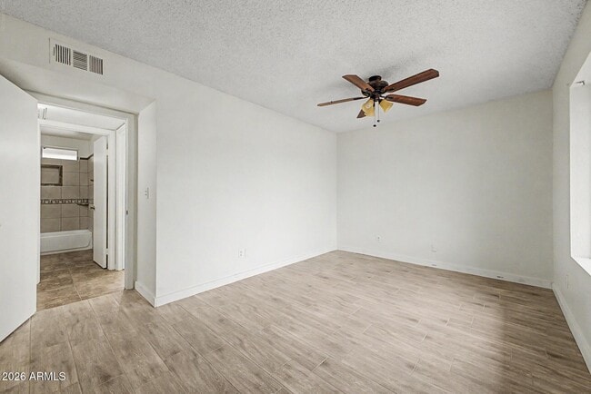 Building Photo - 6616 W Aire Libre Ave
