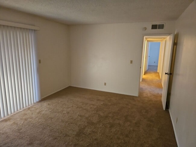 Building Photo - Spacious 4-Bedroom Home with Large Backyard & Covered Patio!