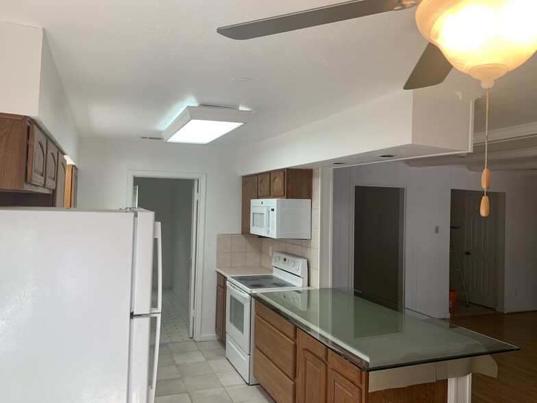 View into kitchen and attached walk in pantry - 2312 Anders Dr