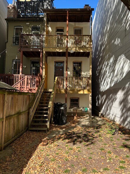 View of rear of home with double porches. - 1336 Kenyon St NW