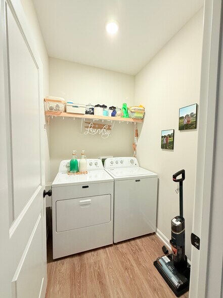 Laundry room shown with washer and dryer included—ready for move-in convenience and everyday use. - 205 Cherry Way