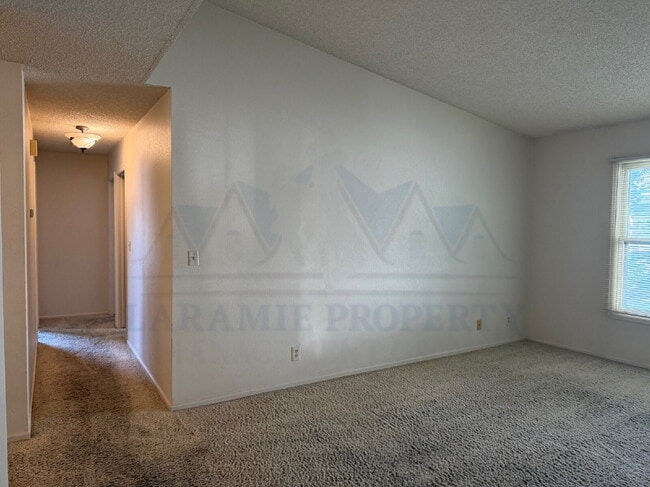 Building Photo - Single-Level 3-Bedroom Townhome with Primary Suite & Attached Garage