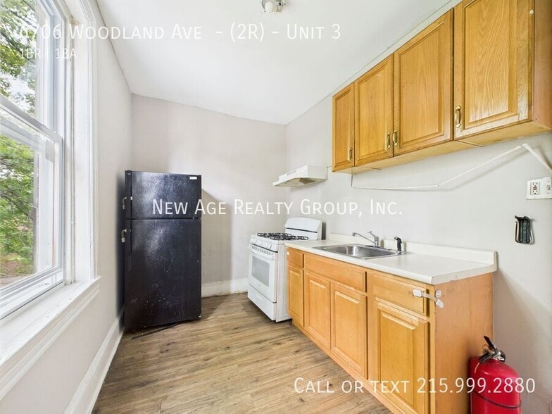 Building Photo - 6706 Woodland Ave