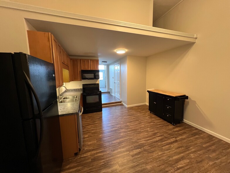 Kitchen from back wall with view of hidden upper storage - 1216 Turner St