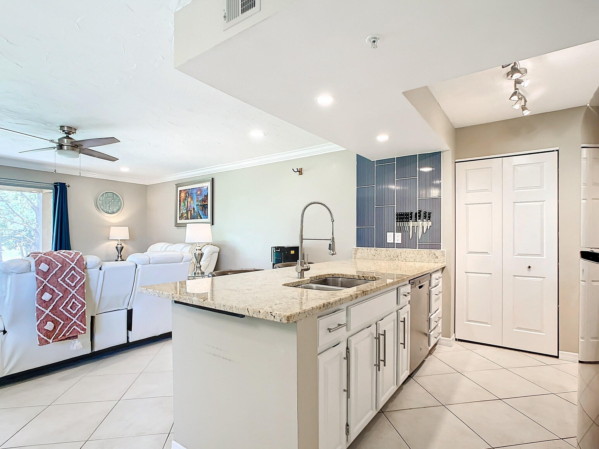 Kitchen, with sitting area at countertop - 2400 Feather Sound Dr Apt 421