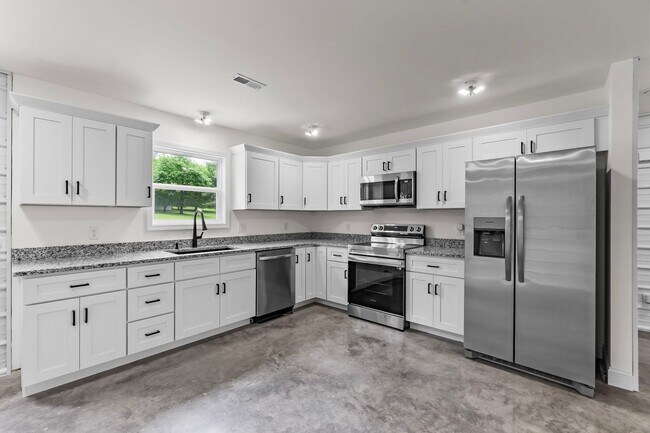 Building Photo - Custom-Built Metal Home with Modern, Energy-Efficient Design