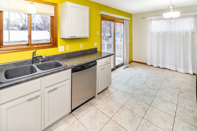 Kitchen, dining & deck view - 874 22nd Ave SE