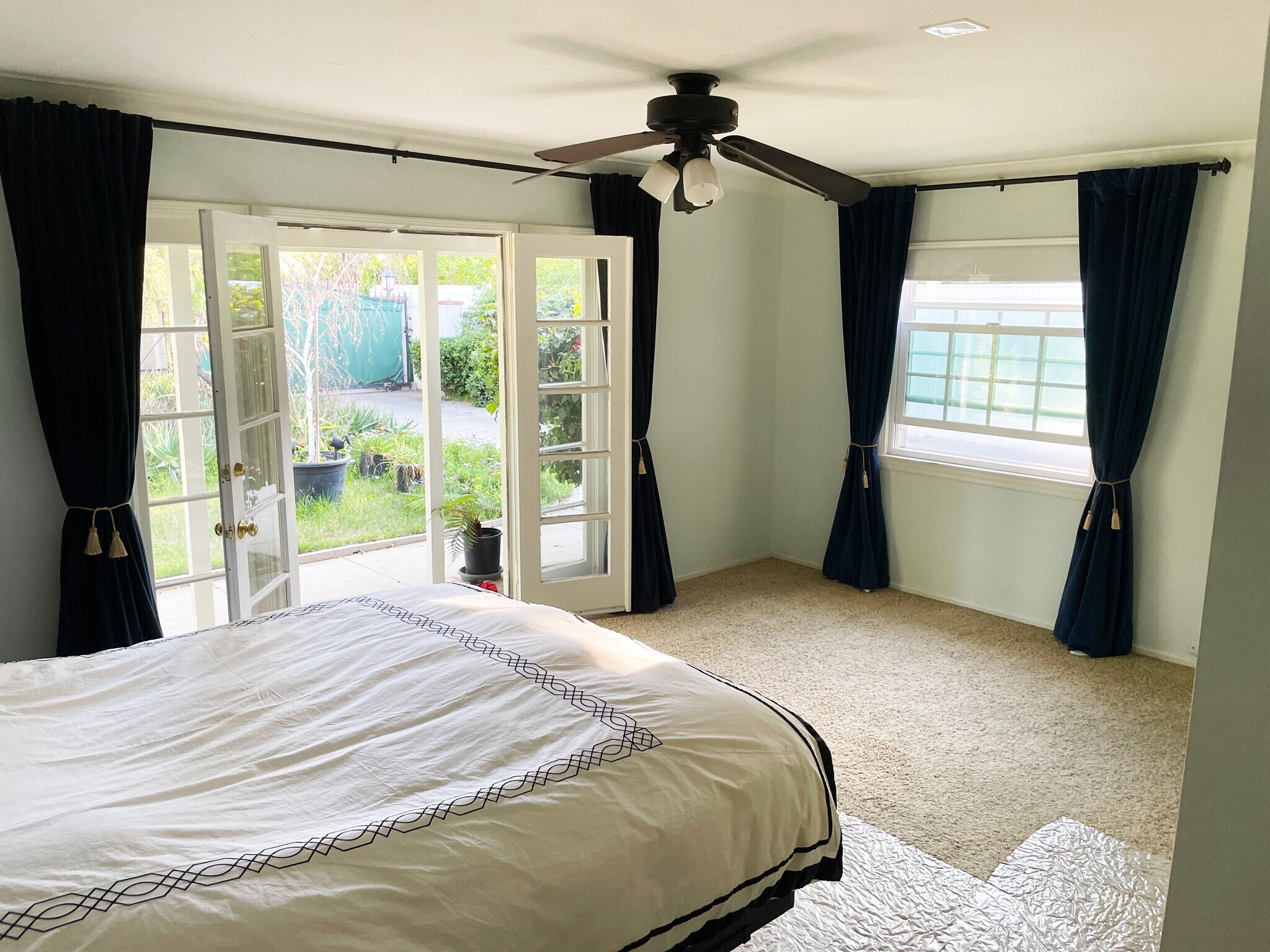 Primary Bedroom with French doors open to the front yard - 15341 Cohasset St