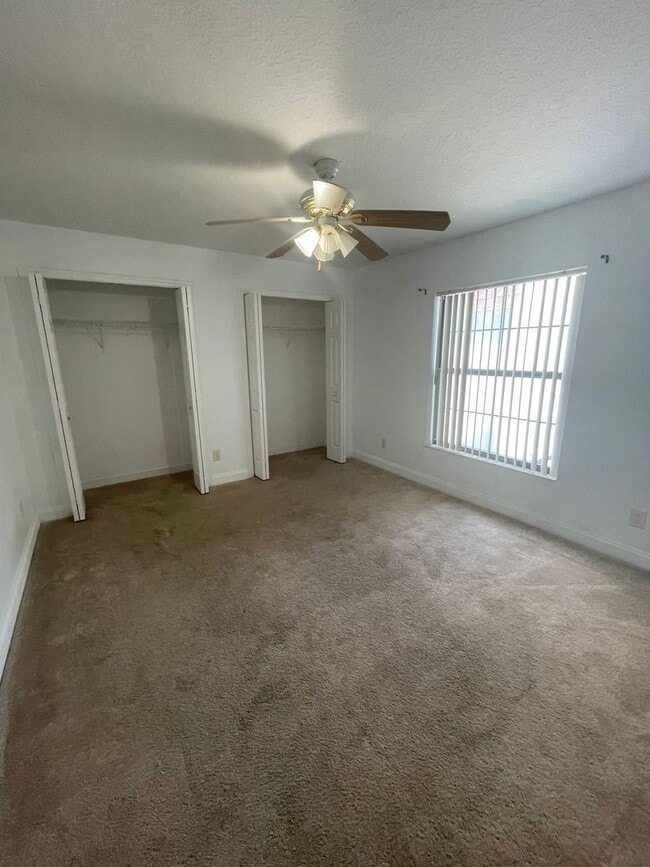 Building Photo - Spacious 4-Bedroom Pool Home – 2 Primary S...