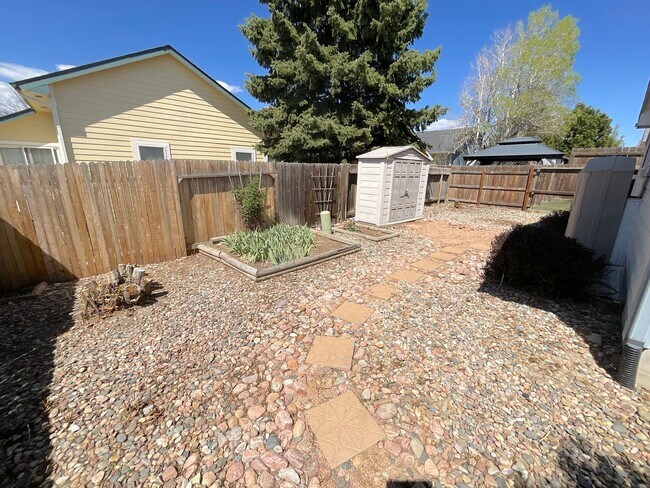 Building Photo - 4 Bedroom Home Available Near Research Pkwy & Scarborough Dr!