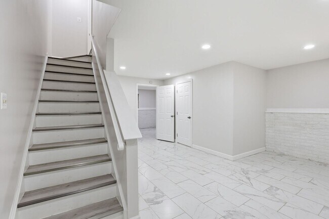 Building Photo - Experience contemporary living in this beautifully renovated residence where modern design meets ...