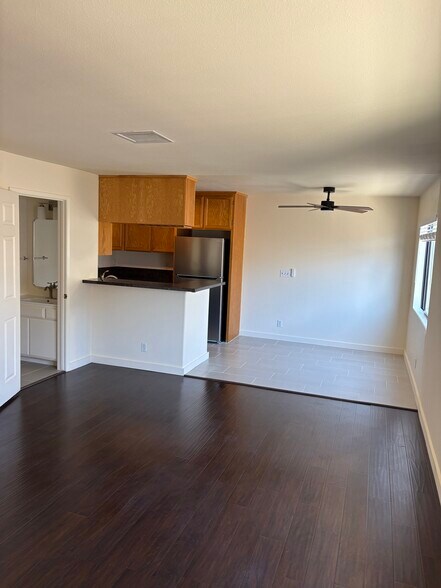 living area towards half bath and kitchen - 2470 Corinth Ave