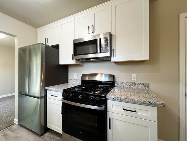 Building Photo - Freshly Renovated 3 Bedroom Home with Large Fenced Yard & Double Garage