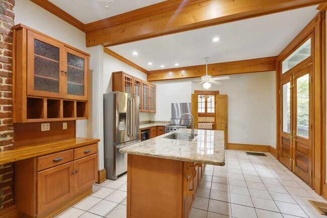 Building Photo - Fabulous University Duplex with gleaming floors and stained glass.