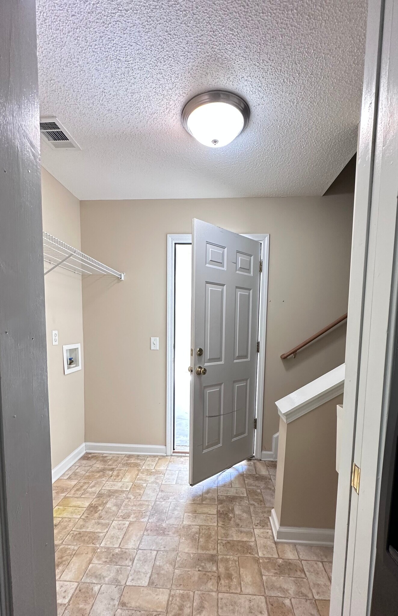 laundry/garage/stairs to bonus room. - 145 White Dogwood Ln