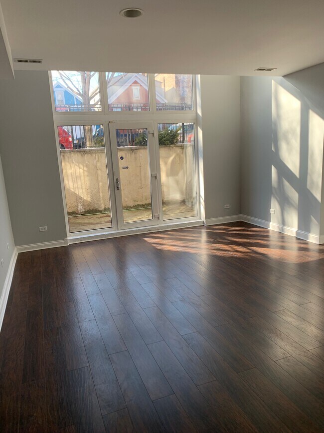 lower level living room, patio viewe - 2327 S Sawyer Ave