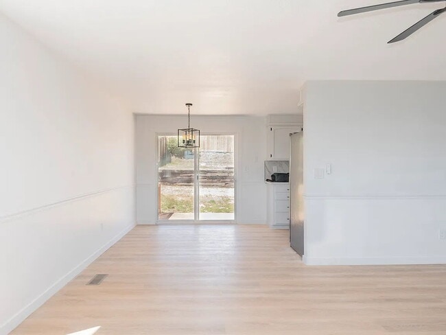 Building Photo - "Charming 5-Bed Sanctuary with Cozy Fireplace on South Rogers Street!"