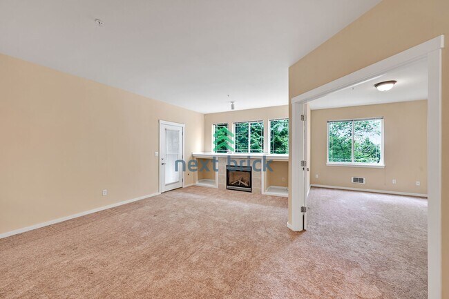 Building Photo - Rare Ground-Floor, End Unit with massive b...