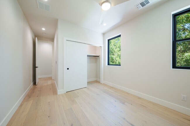 Building Photo - Luxury Redefined: Experience Vibrant Living in this 3-Bedroom Haven in East Austin