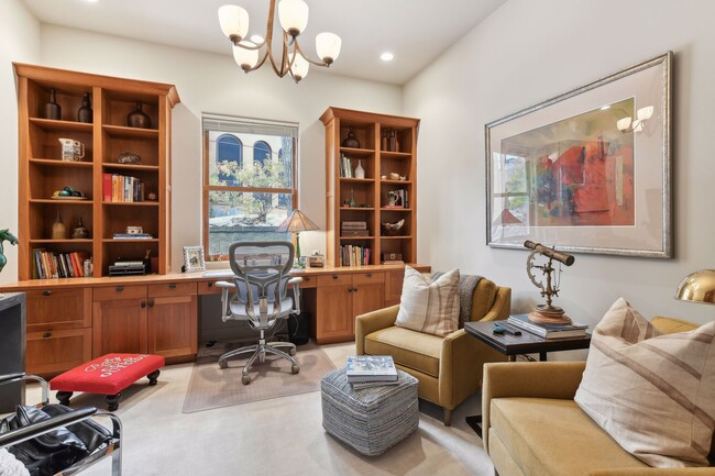 Designated home office space on the main level with built-ins to keep files organized - 745 Rice St E