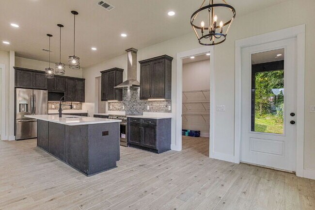 Building Photo - This luxurious new custom home in the sought-after Shadow Grove subdivision is a masterpiece of m...