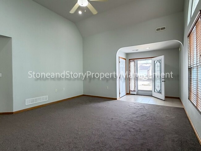 Building Photo - 2 bedroom 1.5 bath duplex with sunroom, 2 car garage and fenced yard