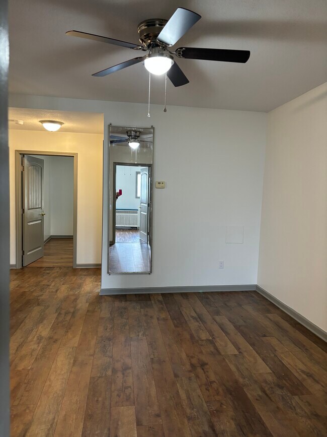 Living room looking into foyer and front bedroom - 135 W Miller Ave