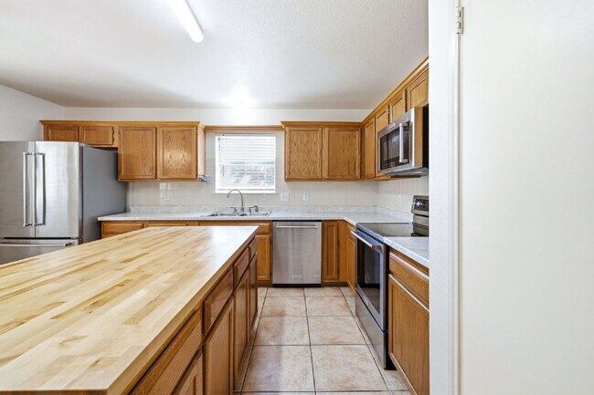 Building Photo - 4 Bedroom home with ZERO carpet close to RAFB