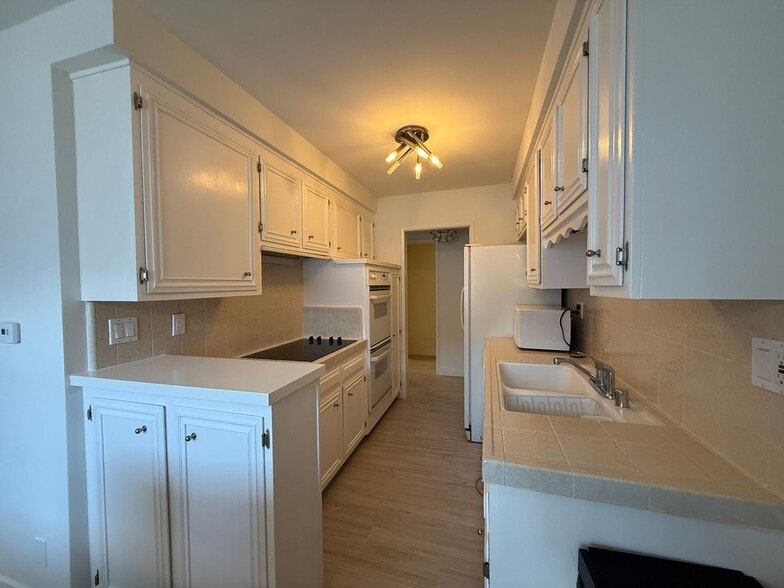 Building Photo - Welcome to 404 San Vicente — Prime Santa Monica Living!