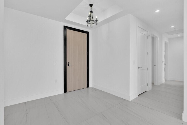 Building Photo - Stunning High-Rise Condo with Ocean Views | Prime Beach Location
