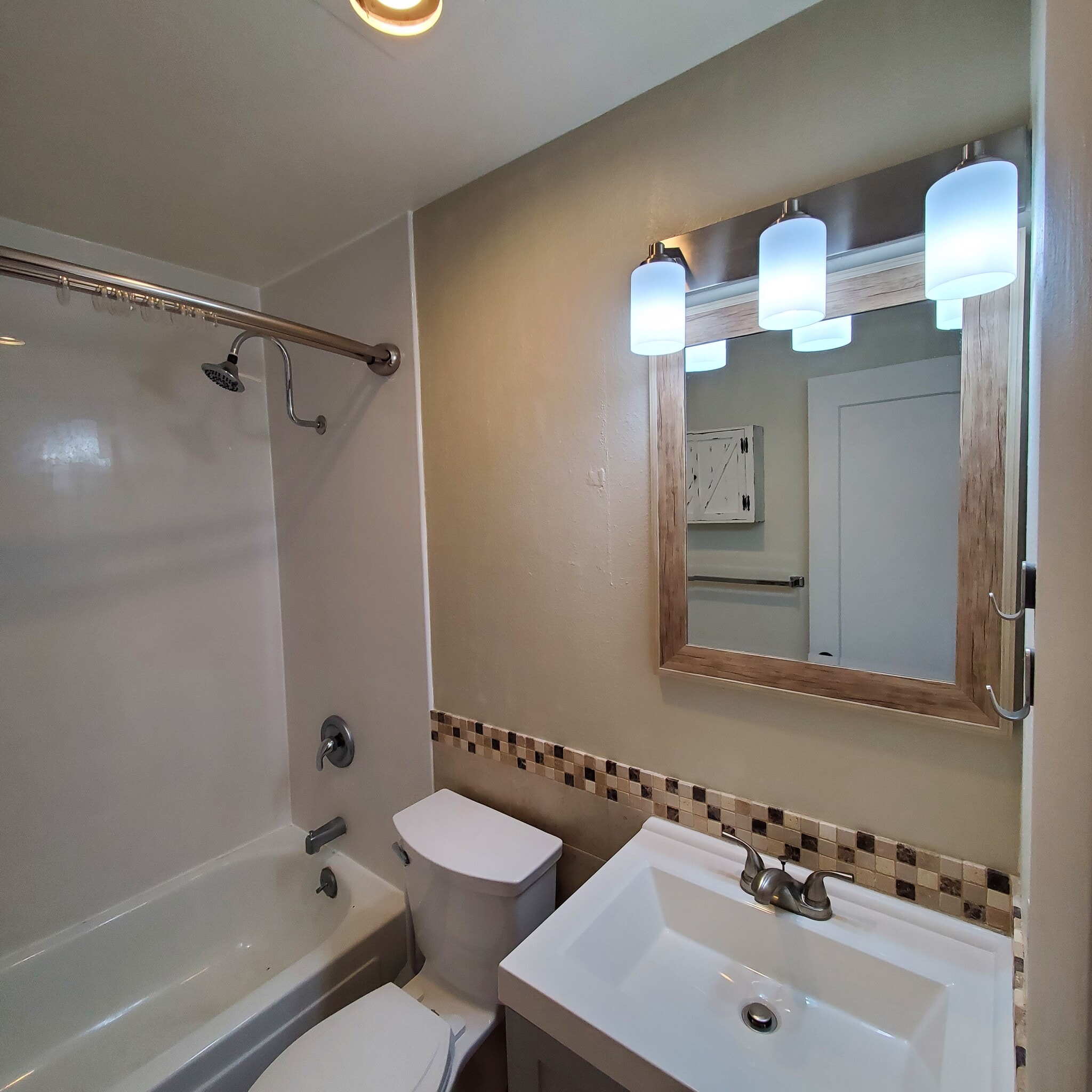 New vanity with cabinet and drawer space - 3161 Madison Ave