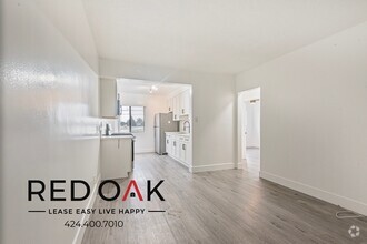 Building Photo - Bright and Welcoming Top Floor Two Bedroom...