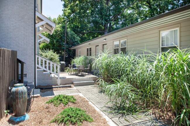 Shared patio with BBQ grill and seating area. Kitchen door provides easy access to this great space. - 1111 Herrin Ave